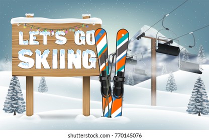 let's go skiing wood board sign and ski equipment