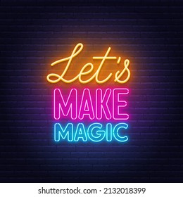 Let's Make Magic neon lettering on brick wall background.