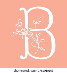 Letter B with floral decoration. Handmade. Letter with plants and flowers.