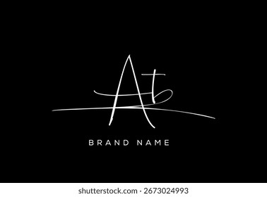 AT letter beauty cursive handwriting logo.