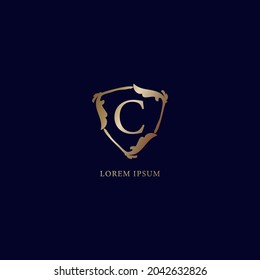 Letter C Alphabet logo design template. Luxury metallic gold security logo concept. Decorative floral shield sign illustration isolated on navy blue background.