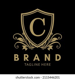 letter c in the gold shield logo