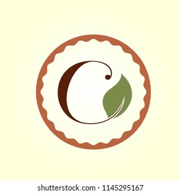 Letter C  with leaf in a circular frame.Letter based logo suitable for nature, health and cooking businesses.