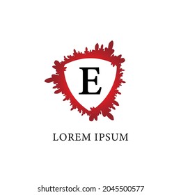Letter E alphabet logo design template. Splash of blood with shield shape in the midle.  Initial abjad logo concept Isolated on white background. Insurance, Protection, horror, security.