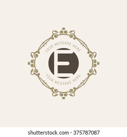 The letter E. Flourishes calligraphic monogram emblem template. Luxury elegant frame ornament line logo design vector illustration. Example designs for Cafe, Hotel, Heraldic, Restaurant, Boutique