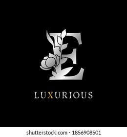 letter E flower leaves decoration for wedding, beauty care logo, personal branding identity, make up artist or any other royal brand and company. luxurious gold and silver color sample in dummy text