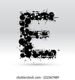 Letter E formed by black and white ink blots