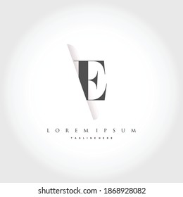 The letter E is inserted into the paper slot template element