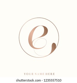 Letter E logo in a circular frame.Luxury style typography icon in rose gold metallic color isolated on light background.Lowercase lettering sign.