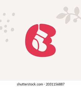 Letter E logo with a sock for Christmas and 2022 New Year design. Perfect for your family gifts package, greeting cards to your colleagues, and t-shirts prints.
