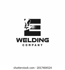 Letter E welding logo, welder silhouette working with weld helmet in simple and modern design style