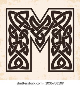 Letter of the English alphabet with Celtic national ornament as interlaced ribbon on a beige background. Paryrus with the aging effect.