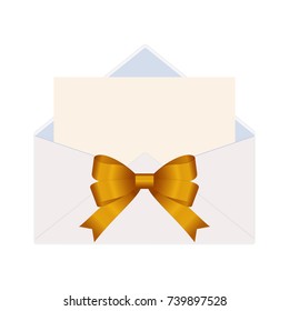 Letter in an envelope decorated with golden ribbon bow. 