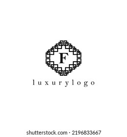 Letter F initial based vector logo. Serif letter logo within complex line art frame. Logo for luxury product, jewelry, fashion, beauty, and company.