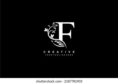 letter F logo design with flowers, leaves and feathers in a beautiful and elegant style. monogram F. typography F. initial F logo. suitable for, business, wedding, boutique, company, hotel, etc