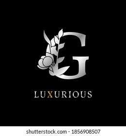 letter G flower leaves decoration for wedding, beauty care logo, personal branding identity, make up artist or any other royal brand and company. luxurious gold and silver color sample in dummy text