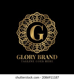 letter G glory mandala vintage golden color luxury vector logo design