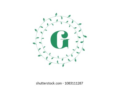 Letter G logo with round green leaves. Elegant floral monogram template design
