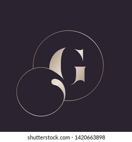 Letter G logo.Typographic icon with uppercase alphabet initial and decorative swirl.Lettering sign in golden, shiny metallic color isolated on dark background.Modern, luxury, boutique style.