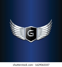 letter G shield with wings gold color logo design concept template vector 3d heraldic shield and wings logo gold / silver emblem