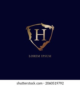 Plantilla de diseño del logotipo alfabético de la letra H. El concepto de logotipo de seguridad metálica de lujo para el oro.  aislado en fondo azul marino. Ilustración de señas de blindaje floral decorativa