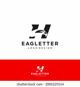Letra H logotipo de la cabeza del águila color vectorial negro y fondo rojo