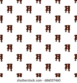 Letter H from latin alphabet with numbers and symbols made of dark melted chocolate