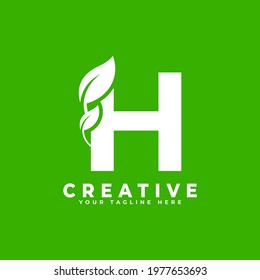 Letter H with Leaf Logo Design Element on Green Background. Usable for Business, Science, Healthcare, Medical and Nature Logos