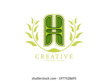 Letter H Unique Logo with leaf ornament as a frame looks more natural, modern design, suitable for templates or brands.