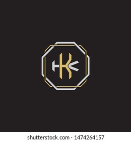 Letter initial KK K monogram logo classic style with emblem hexagon line isolated on black background and gold silver colors combination