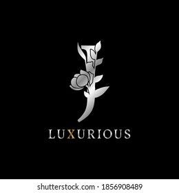 letter J flower leaves decoration for wedding, beauty care logo, personal branding identity, make up artist or any other royal brand and company. luxurious gold and silver color sample in dummy text