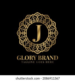 letter J glory mandala vintage golden color luxury vector logo design