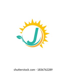 Letter J icon logo with leaf combined with sunshine design concept