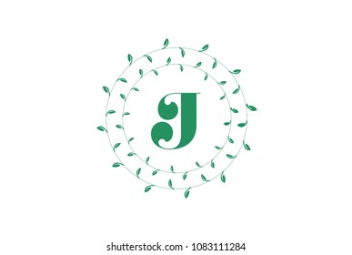 Letter J logo with round green leaves. Elegant floral monogram template design