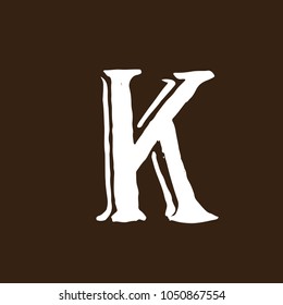 Letter K. Handwritten by dry brush. Rough strokes textured font. Vector illustration. Grunge style elegant alphabet.