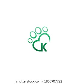 Letter K icon on paw prints logo design