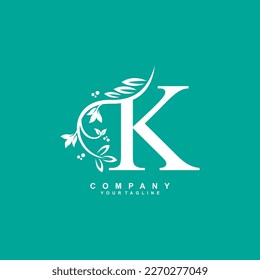 letter K logo design with flowers, leaves and white feathers with a beautiful and elegant style. monogram K. typography K. initial K logo. suitable for beauty, business, spa, salon, wedding, boutique