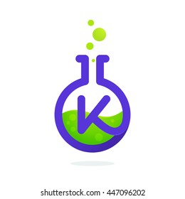 Letter K logo in laboratory beaker. Vector elements for science, biology, physics or chemistry design.
