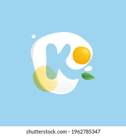Letter K logo on a Fried Egg with green leaf and splashes. Negative space vector icon for farm company, ecology cafe, tasty poster, fast food restaurant.