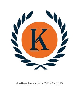 the letter K in an orange and black circle