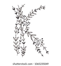 Letter K sign design template. A letter gathered from branches with leaves. Black and white silhouette