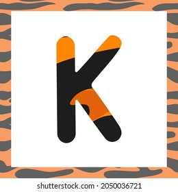 Letter K with tiger pattern. Festive font and frame from orange with black stripes alphabet, symbol for New Year and Christmas