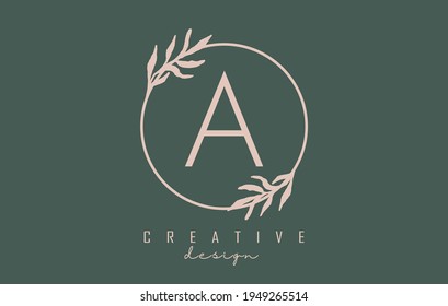 Letter A Logo with circle frame and pastel leaves design. Rounded vector illustration with letter A and pastel leaf for beauty, fashion, jewelry, luxury, natural products or eco services.