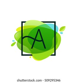 Letter A logo in square frame at green watercolor splash background.  Green art. Vector ecology typography for your posters, invitations, cards. 