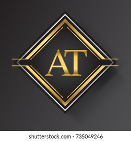 AT Letter logo in a square shape gold and silver colored geometric ornaments. Vector design template elements for your business or company identity.