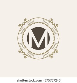 The letter M. Flourishes calligraphic monogram emblem template. Luxury elegant frame ornament line logo design vector illustration. Example designs for Cafe, Hotel, Heraldic, Restaurant, Boutique