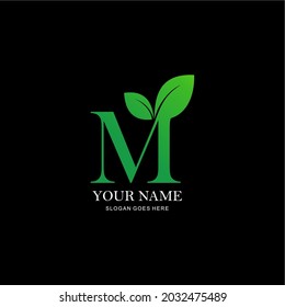 letter M and leaf logo. vector combination of letter M and green color leaf. initials M green themed business logo