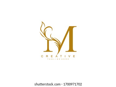 Letter M Linked Artistic Gold Flourish Swoosh Shape Logo
