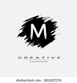 Letter M Logo With Brush Stroke and Splatter Elements. Handwritten Brush Stroke letter M logo design. Creative template suitable for company, logotype, emblem, monogram, jewelry, cosmetic, brand name.