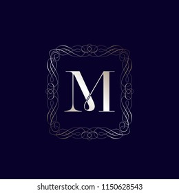 Letter M logo in a filigree frame.Shiny golden serif uppercase lettering in a decorative emblem.Vector icon isolated on dark blue background.Rich, elegant, luxury style.